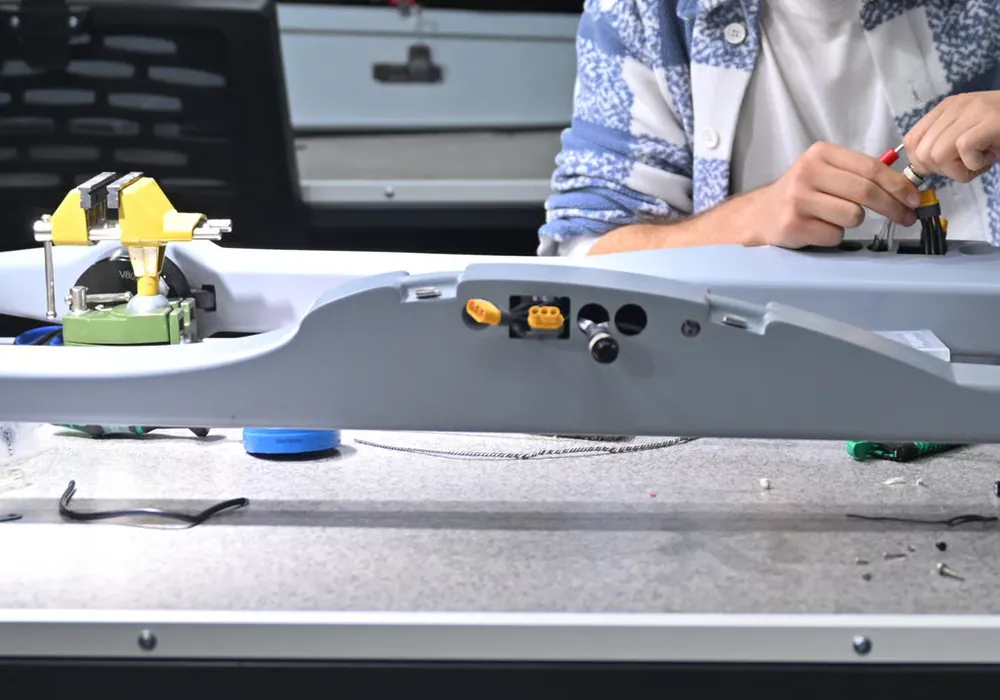 Connectors being wired into the fuselage of a SkyCopes aircraft